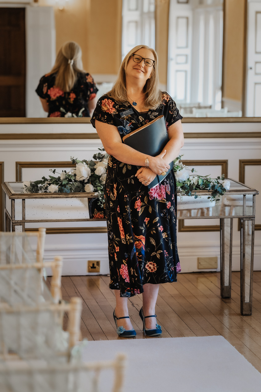 Deb Reed Celebrant Essex Colchester posing with arms out smiling.